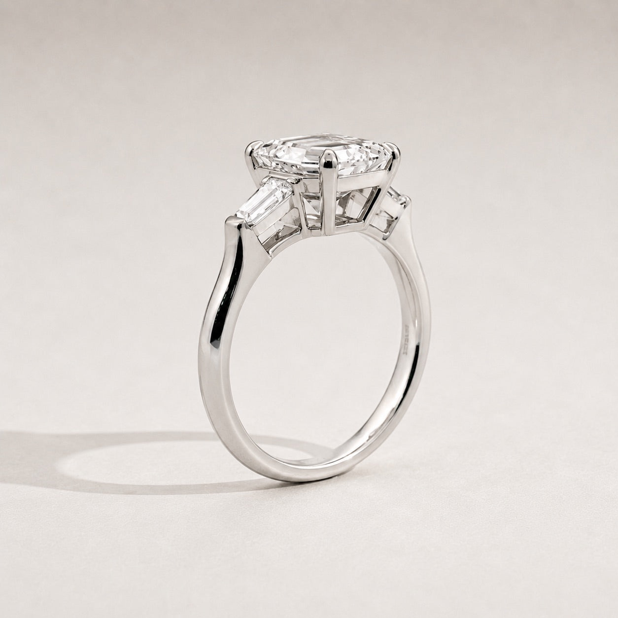 Emerald Trilogy Three Stone Engagement Ring side view