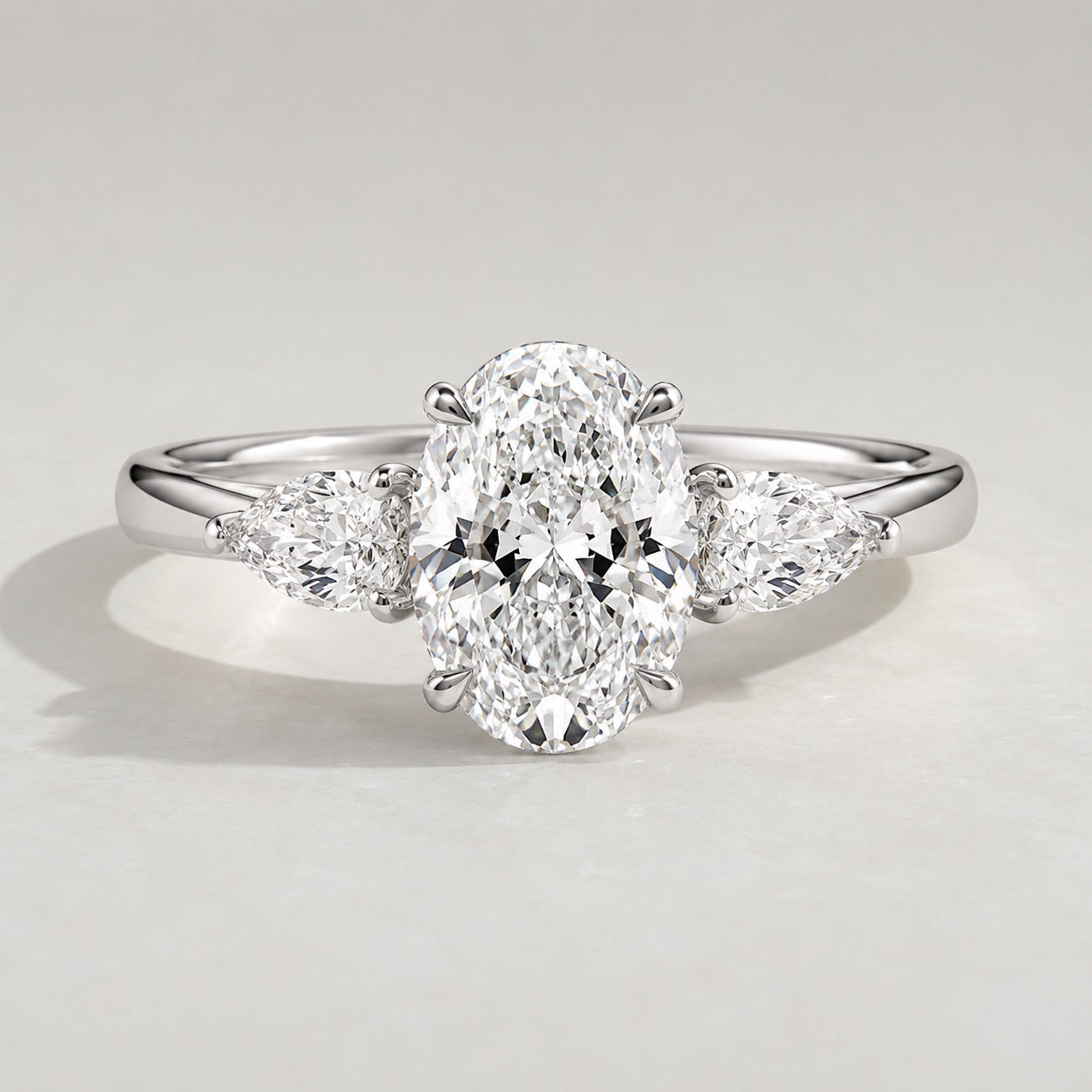 Oval Trilogy Three Stone Engagement Ring by Chalyano