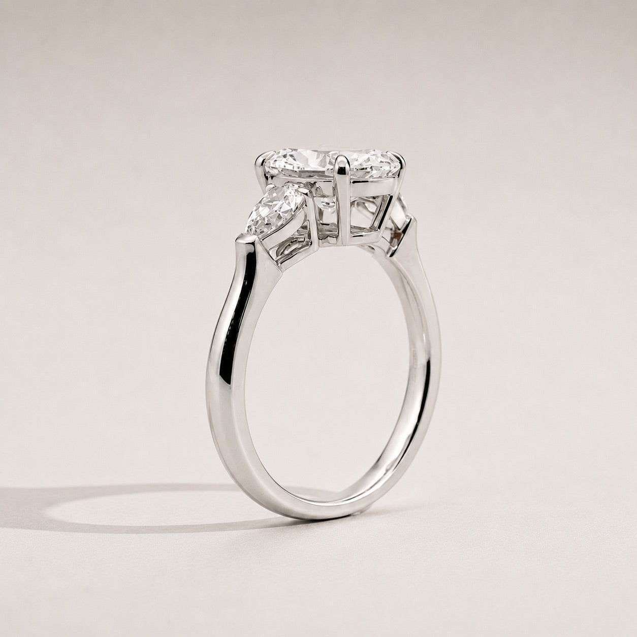 Oval Trilogy Three Stone Engagement Ring side view