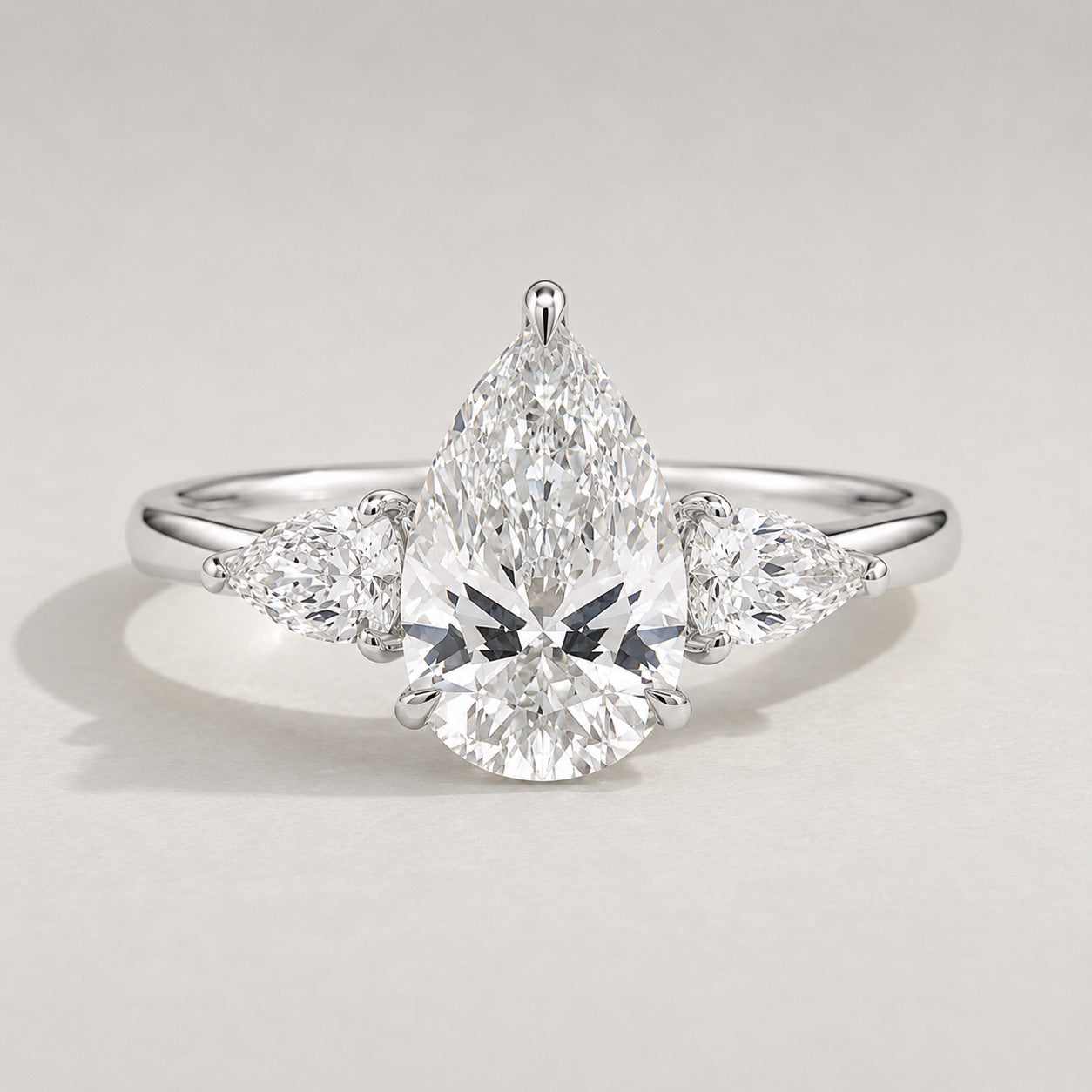 Pear Trilogy Three Stone Engagement Ring by Chalyano