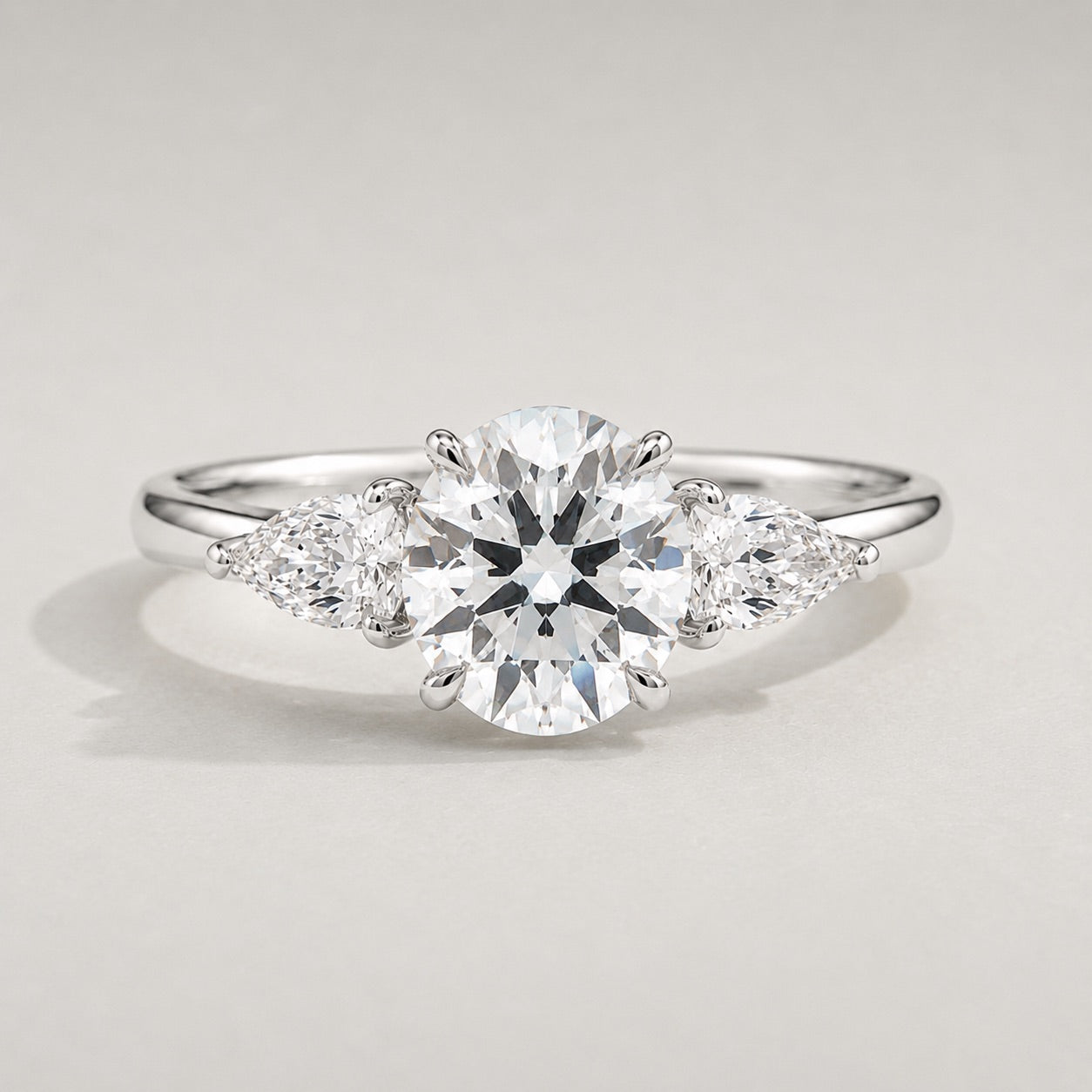 Round Trilogy Three Stone Engagement Ring by Chalyano
